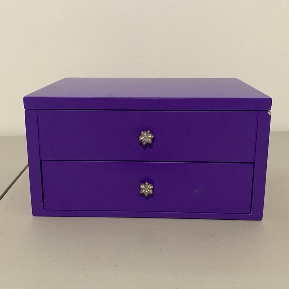 Purple jewelry box with flower knobs